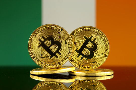 Physical version of Bitcoin and Ireland Flag. Close up.