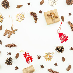 Christmas decoration, tree, snowflakes and pine cones on white. Flat lay, top view. Frame concept. 
