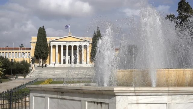 fountain in the background of Zappeion - a building in classical style in Athens