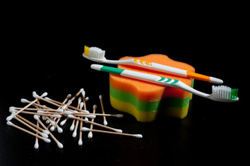 New, beautiful toothbrushes on a dark background