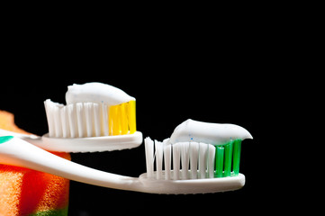 New, beautiful toothbrushes on a dark background