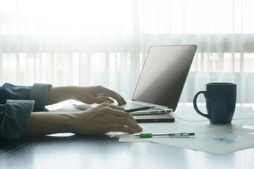 Fototapeta premium businessman typing message computer and holding pencil .concept of business people work from anywhere with technology