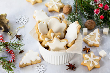 Christmas baking. Gingerbread in a cup and decorative ornaments on a festive table.