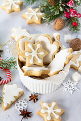 Christmas baking. Gingerbread in a cup and decorative ornaments on a festive table.