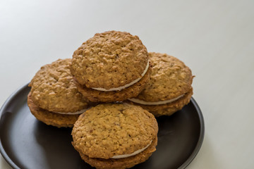 Close up Homemade Malt and Oat Cookie Sandwiches . (selective Focus)