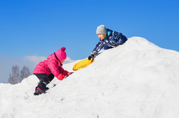 Young children playing on winter walk