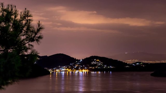 4K Timelapse at Salamina Island by night with clouds