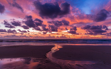 Dramatic cloudy sky in twilight covered sea and beach in Phuket, most attractive place of Thailand.