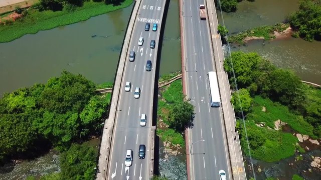 Aerial video over a bridge over the piracicaba river, inside the city.