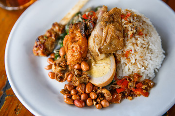 spicy balinese nasi campur with ice tea