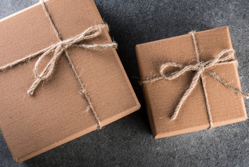 Two Brown gift box on dark background. Christmas, new year, birthday or valentine day present