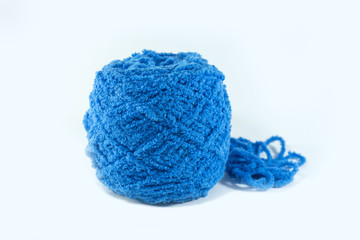 Blue ball of yarn on a white background.