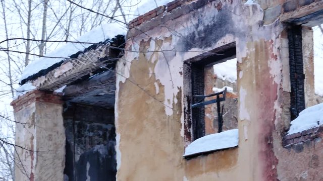 Interior of ruined, abandoned administrative, residential building after fire. Ruin The ruins of an abandoned ruined house. As depressive background for thrash design