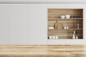Fototapeta premium White kitchen, wooden bar stand blur