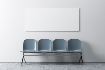 White room, gray chairs, poster