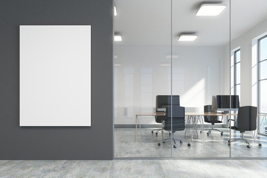 Dark gray office lobby, a meeting room with poster