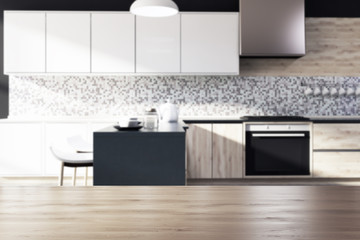 Black mosaic kitchen interior, wood blur