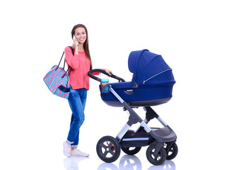 Full length portrait of a mother with a stroller, isolated on white background. Young mom