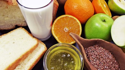 Healthy eating.Milk,honey with fruit and fresh bread.