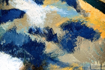 Abstract paint brush on colorful wall background with kid. Acrylic hand painted with earth tone. Fashion and street. Close up.