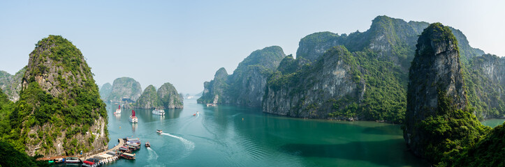 Busy cove near Sung Sot Cave in Halong Bay, Vietnam - obrazy, fototapety, plakaty