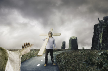 Man Holding Cross is Following Jesus-Follow Jesus Christian Concept