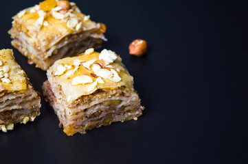 Baklava dessert slices on dark background