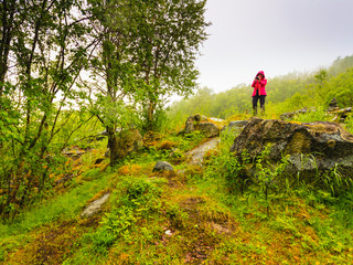 Tourist taking photo in mountains Norway