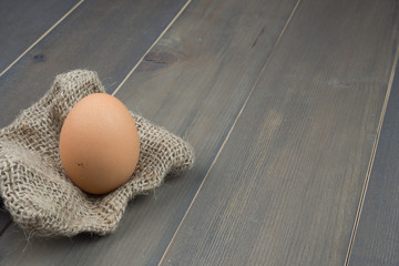 Egg on wooden table background