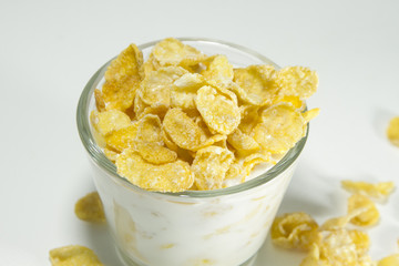 Glass of milk and corn flakes for a breakfast	