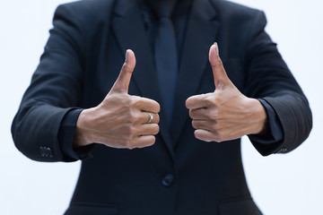 Business people in suit on thumbs up