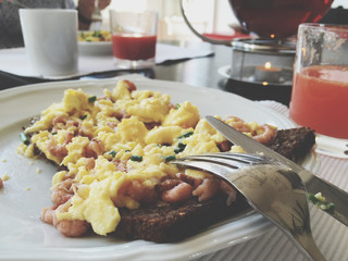Breakfast with scrambled eggs and shrimps