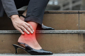 Business woman hurt ankle inflammation.
