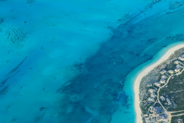 View of Turquoise Sea and Sandy Beach from an Airplane
