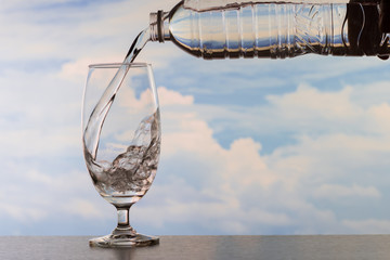 Fototapeta na wymiar Drinking water poured into the glass.