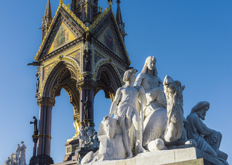 Fototapeta na wymiar The Albert Memorial is situated in Kensington Gardens, London, directly to the north of the Royal Albert Hall. It was commissioned by Queen Victoria in memory of her beloved husband, Prince Albert