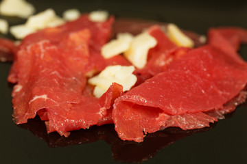 Carpaccio with olive oil and parmesan cheese