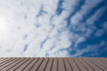 Natural wood decking is empty. With a beautiful backdrop of beau