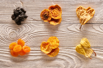 Dried fruits on wooden background