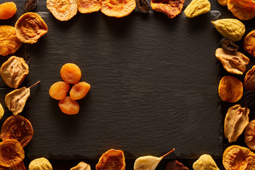 Dried fruits on slate plate
