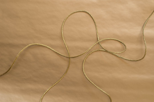 golden twine on golden background