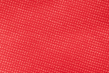 Bright red monochrome embossed texture diagonally to the left from the bottom to the right upwards