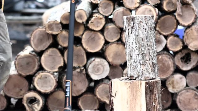 Wood Splitting Chopping Fire Wood with an Axe