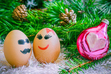 Lovers on  Christmas, cartoon . Unusual eggs with faces, muzzle.