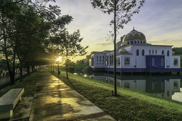 Mosque with jogging walkway with sunrise flare