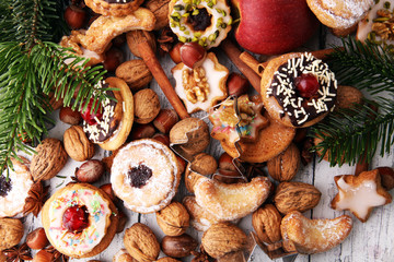 Christmas border. Xmas Gingerbread cookies, spices and decorations on wooden background