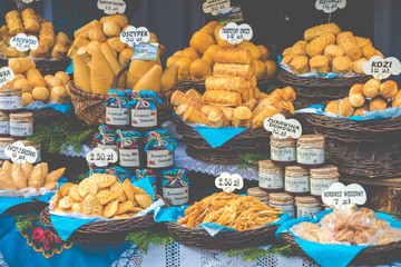 Traditional polish smoked cheese oscypek on christmas market in Cracow. Oscypek is made exclusively in Tatra Mountains region of Poland.
