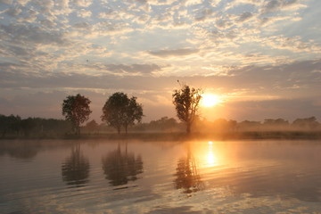 Sunset over yellow river in Kakadu National Park, Northern Territory, Australia near Darwin