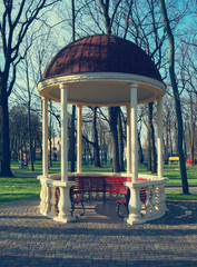 Autumn landscape. Gazebo with columns on the park
