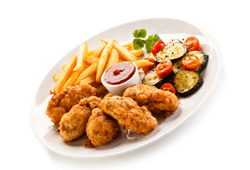 Fried chicken nuggets and vegetables 